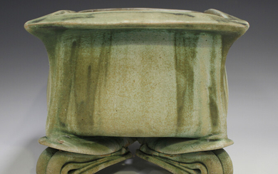 A John Alliston studio pottery square planter, late 20th century, raised on four stylized folded fee