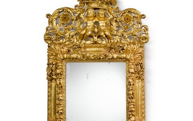 A LOUIS XIV GILTWOOD MIRROR IN THE MANNER OF JEAN LE PAUTRE, LATE 17TH CENTURY
