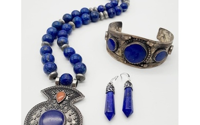 A Lapis Lazuli Jewellery Suite: Cuff bangle, necklace and ea...