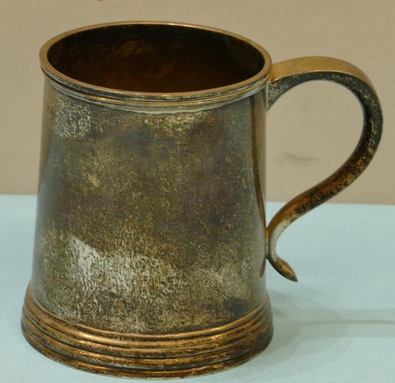 A Late Victorian Silver Christening Mug having scroll handle...