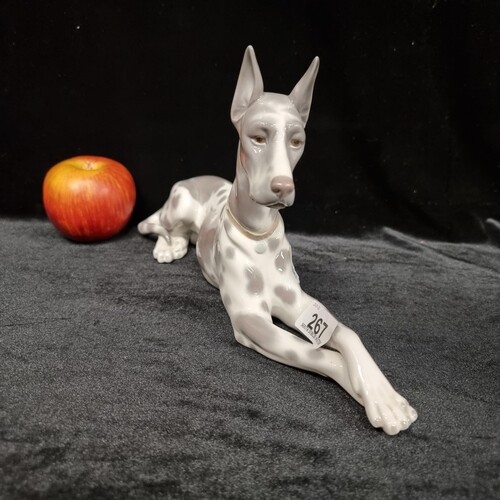 A "Lladro" Porcelain figurine of a perched Great Dane dog wi...
