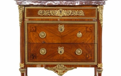 A Louis XVI Gilt Bronze Mounted Tulipwood Commode with