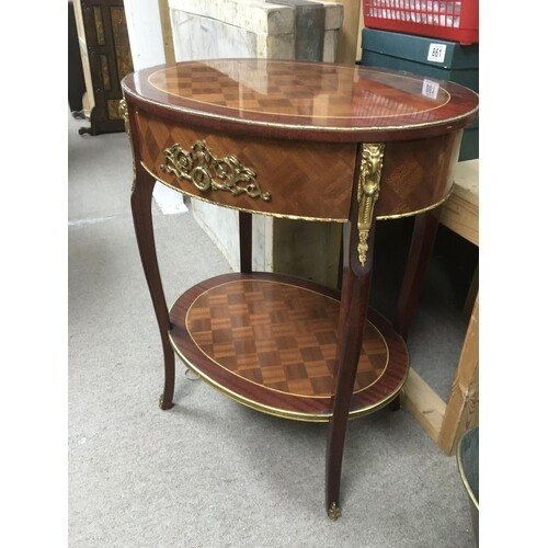 A Louis XVI style two tier side table with Ormolu mounts, ap...