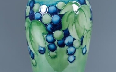 A Moorcroft Pottery Baluster Shaped Vase, decorated in greens...
