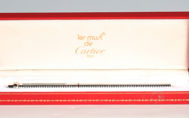 A Must de Cartier silvered ballpoint pen, with original case.