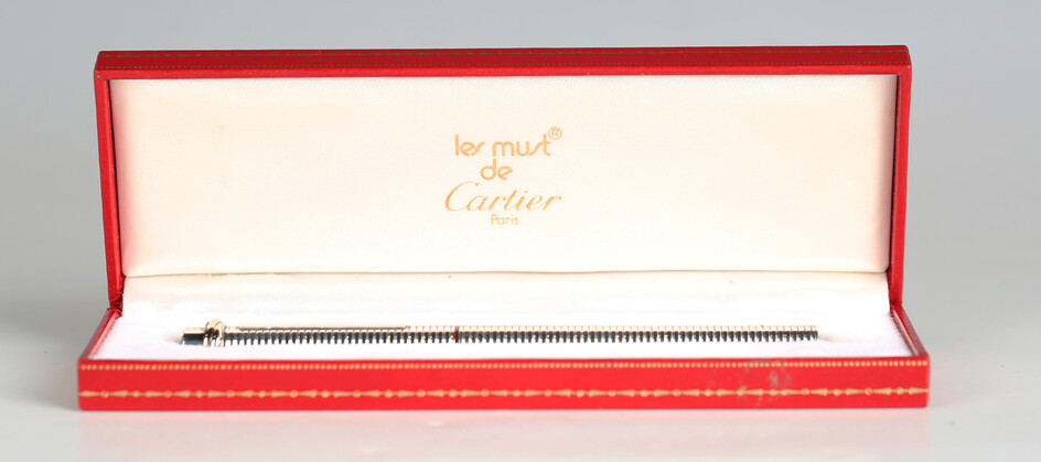 A Must de Cartier silvered ballpoint pen, with original case.