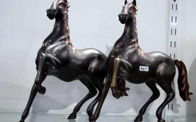 A PAIR OF BRONZED HORSE FIGURINES