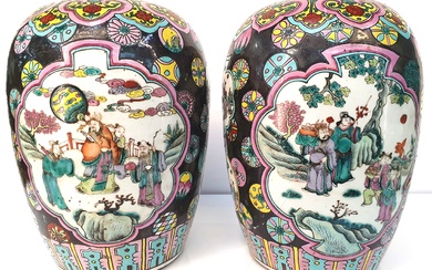 A PAIR OF CHINESE MID/LATE QING DYNASTY FAMILLE NOIR VASES; ovoid with black ground and two shaped panels of figures in landscape