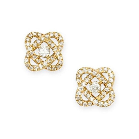 A PAIR OF DIAMOND KNOT EARRINGS in 18ct yellow gold, set to the centre with a round brilliant cut