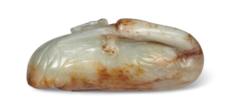 A PALE GREENISH-WHITE AND RUSSET JADE CARVING OF A RECUMBENT CRANE, CHINA, LATE MING DYNASTY, 17TH-18TH CENTURY