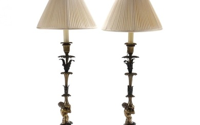 A Pair of Continental Patinated and Gilt Bronze Triton Lamps