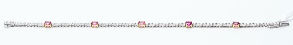 A RUBY AND DIAMOND LINE BRACELET IN 18CT WHITE GOLD, COMPRISING FIVE OVAL RUBIES TOTALLING 1.47CTS AND SEVENTY TWO ROUND BRILLIANT C...