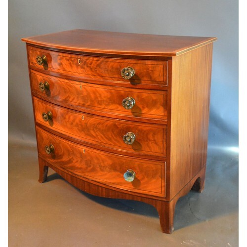 A Regency Mahogany Bow Fronted Chest, the cross banded and i...