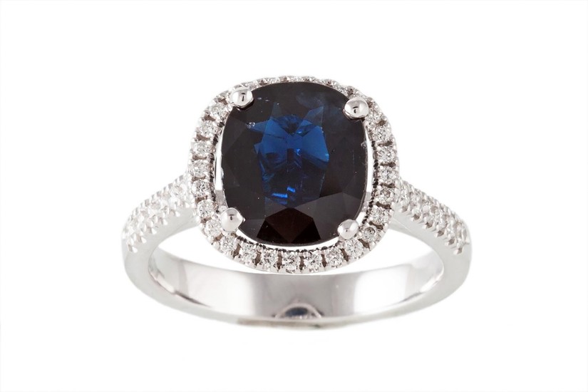 A SAPPHIRE AND DIAMOND RING, the sapphire estimated to weigh...