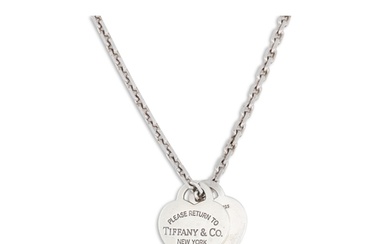 A SILVER TIFFANY PENDANT, stamped 'I Love you, Tiffany & Co....