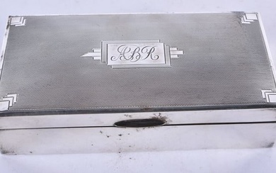 A Silver Cigarette Box with Engine Turned Decoration and wooden interior by Saunders & Mackenzie.