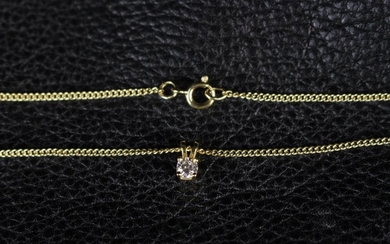 A Single Stone Diamond Pendant with Gold Chain. The pendant set with a round brilliant cut diamond