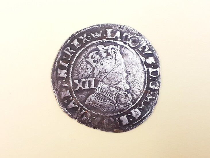 A United Kingdom James I silver shilling of 12 pence, c. early 17th century.