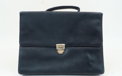 A black leather Nino Cerruti briefcase, with metal clasp securing a flap, with two section interior and pocket to the verso, handle to the top, authentication card inside, 35.5cm x 26.5cm, with black dust bag