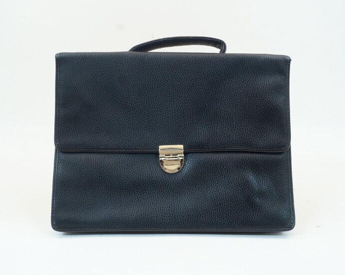 A black leather Nino Cerruti briefcase, with metal clasp securing a flap, with two section interior and pocket to the verso, handle to the top, authentication card inside, 35.5cm x 26.5cm, with black dust bag