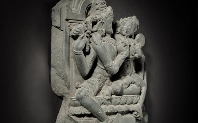 A black stone stele depicting Uma-Maheshvara, East India, Pala period, 11th / 12th century