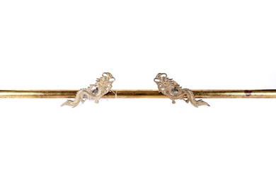 A brass curtain or wall hanging display pole