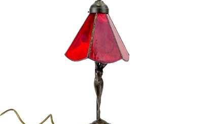A bronzed metal figural table lamp base after Moreau, modelled with a female nude.