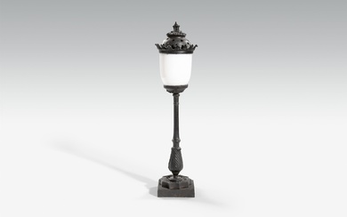 A cast iron lamp formed as a streetlight