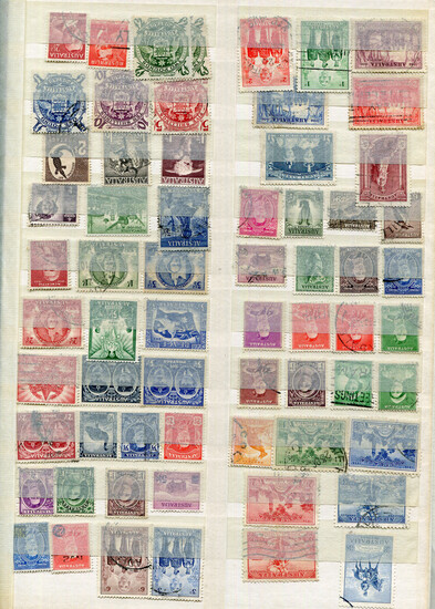 A collection of world used stamps in twenty stock books, including British Commonwealth, Ascension