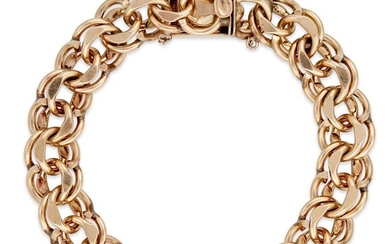 A fourteen karat gold bracelet designed as heavy, polished...
