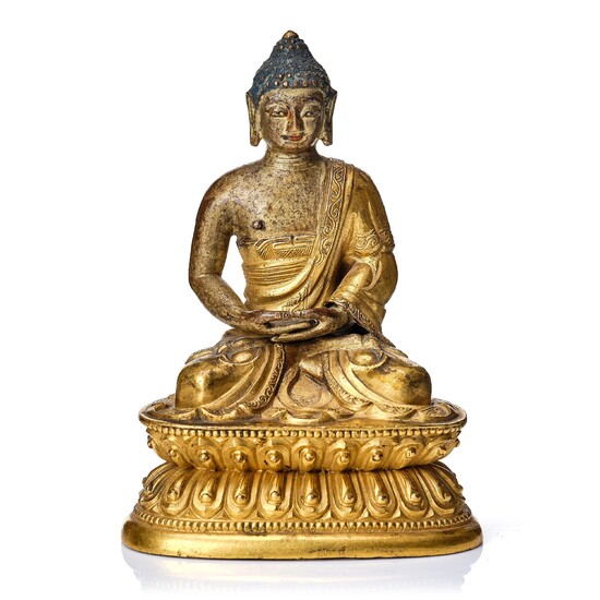A gilt kopper alloy figure of buddha, Tibeto-Chinese, 18th Century.