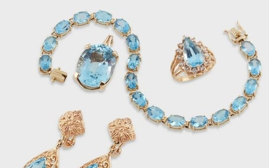 A group of blue topaz and fourteen karat gold jewelry