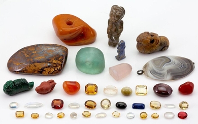 A group of gem stones and reproduction antique figures, gems include: a group of moonstones and citrines, a polished opal in matrix, a polished amber block, and agate seal, a glass seal pendant, and a banded agate pendant (a lot)