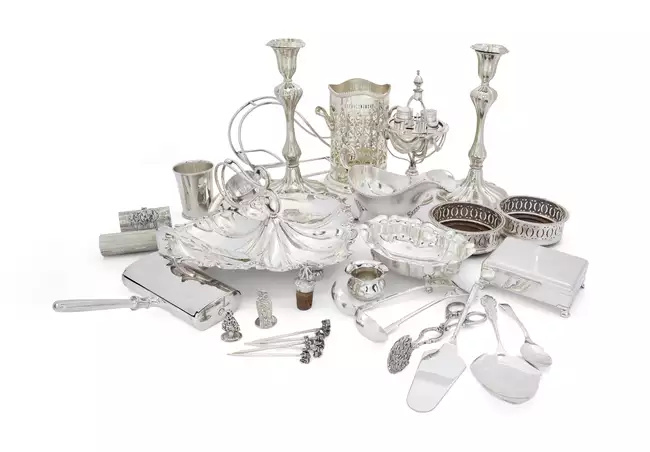 A group of silver plate The group including: a pair of candlesticks, with knopped stems and...