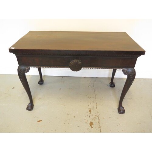 A mahogany serving silver table with carved shaped legs on b...