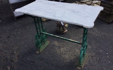 A marble topped garden table, the rectangular slab with rounded...