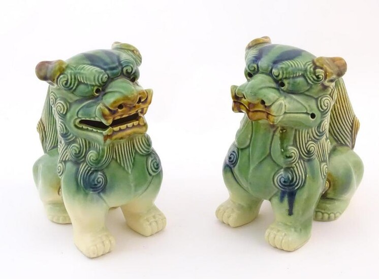 A matched pair of Chinese models of foo dogs / guardian
