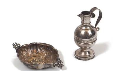 A miniature Victorian silver communion wine ewer, Exeter, c. 1876, Josiah Williams & Co., the rounded body with a band inscribed 'Glory be to God on high', 10cm high, together with a small repousse twin-handled bonbon dish, unmarked, assumed...