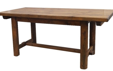 A modern pine refectory table, the plank top raised on cylindrical supports, joined by stretchers, 74cm high, 170cm wide, 85cm deep