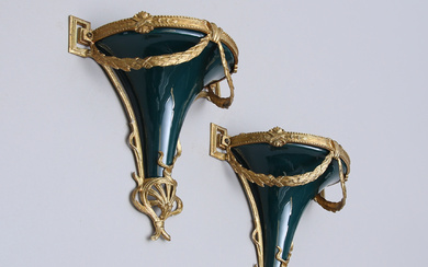 A pair of 20th century Empire style wall brackets.