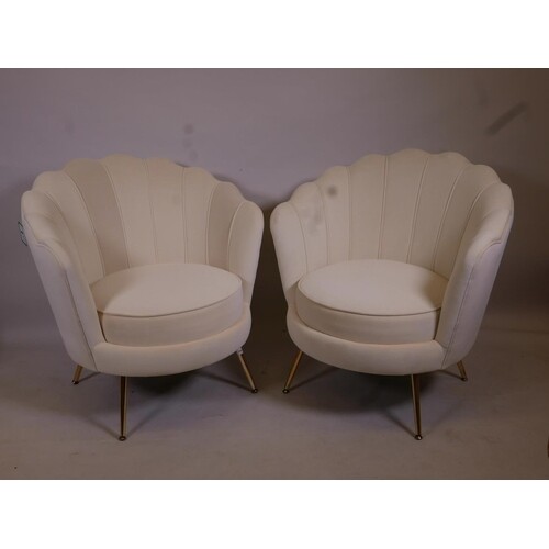 A pair of Art Deco style cream velvet clam shell chairs on b...
