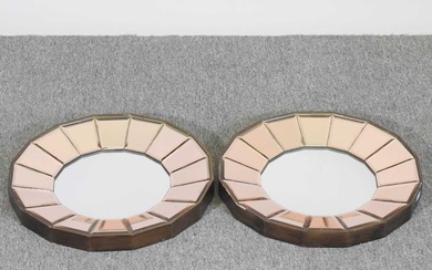 A pair of Art Deco style wall mirrors, of circular...