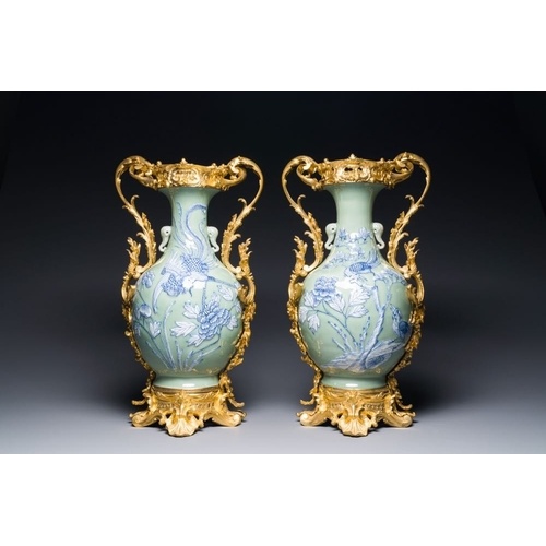 A pair of Chinese blue and white celadon vases with gilt bro...
