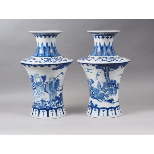 A pair of Chinese blue and white flared vases with figures i...