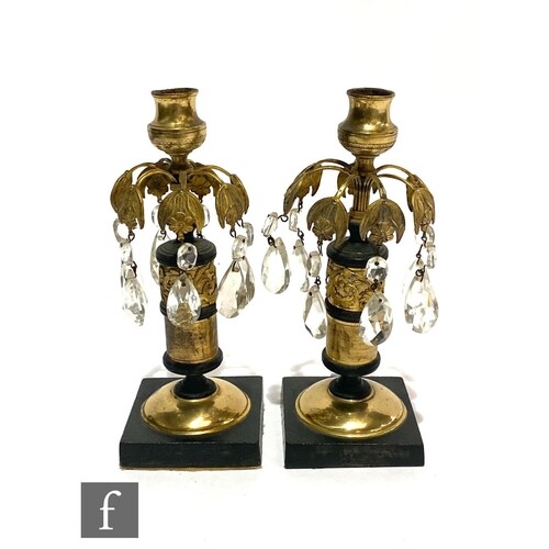 A pair of Empire style gilt table lustres with applied acant...