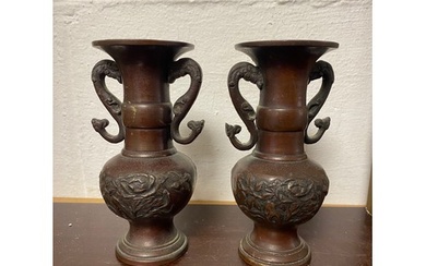 A pair of Japanese bronze vases, each with scrolled dragon h...