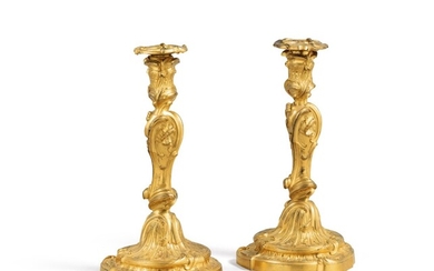 A pair of Louis XV gilt-bronze candlesticks, in the manner of Jules-Aurèle Meissonnier (1675-1750), circa 1730 | Paire de flambeaux en bronze ciselé et doré d'époque Louis XV, dans le style de Jules-Aurèle Meissonnier (1675-1750), circa 1730