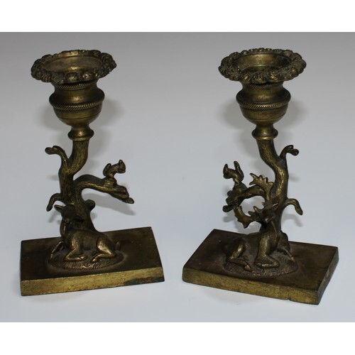 A pair of Regency gilt bronze mantel candlesticks, cast wit...