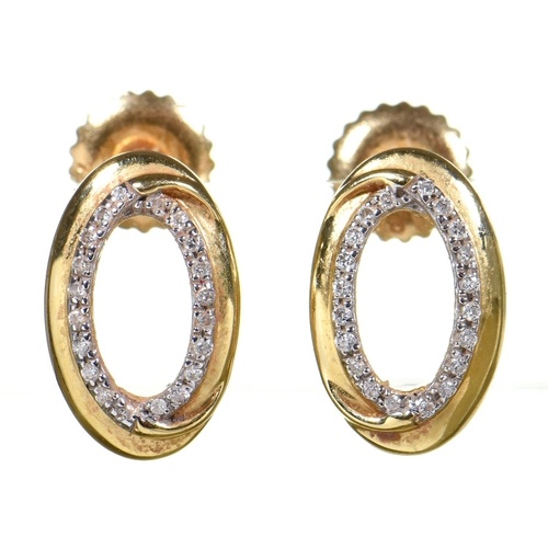 A pair of diamond stud earrings, in gold marked 18K, 1.2g
