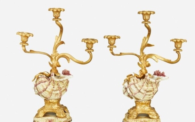 A pair of gilt-bronze and porcelain shell candlesticks